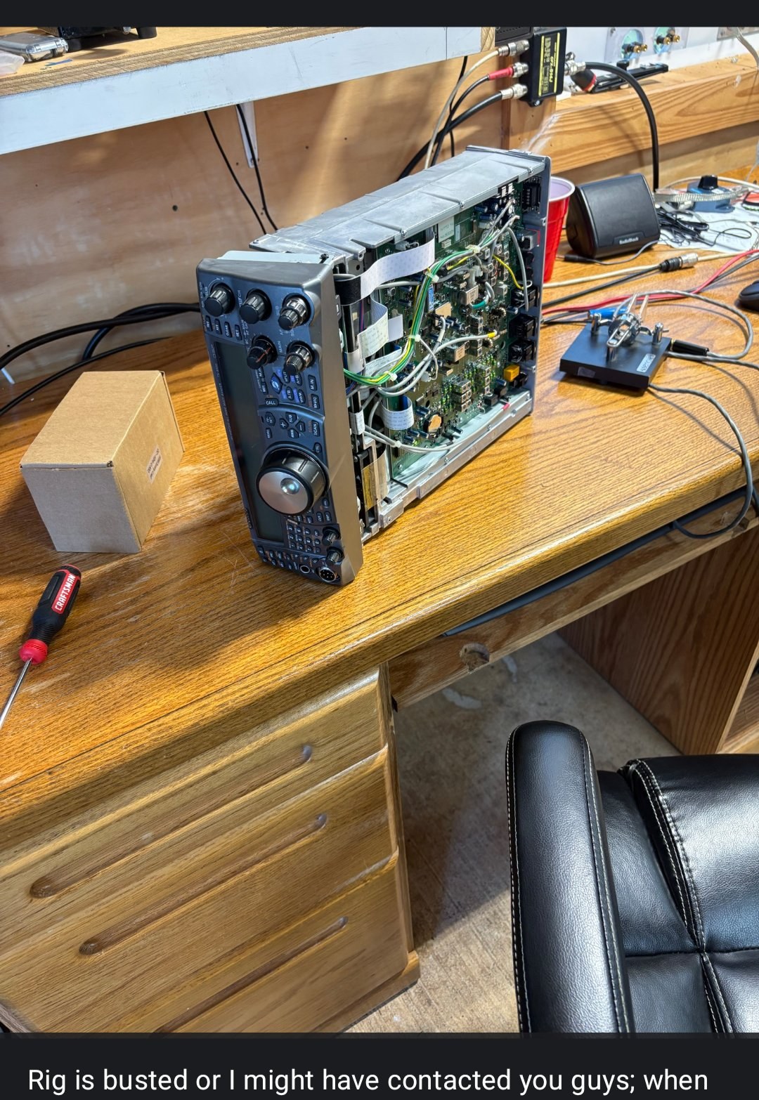 WB4MBV’s transceiver opened up on the workbench for repair
