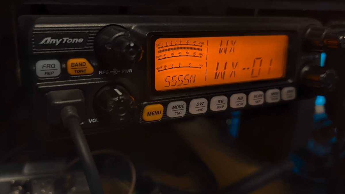 An AnyTone 5555N mobile radio display showing the WX weather channel